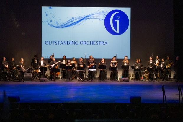 The student orchestra performs live