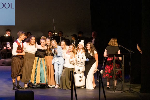 A costumed ensemble number