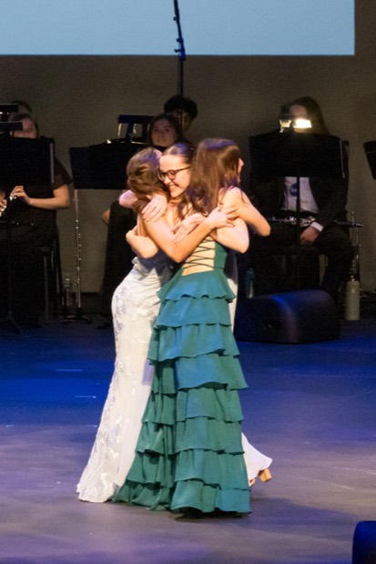 A heartfelt embrace after an award