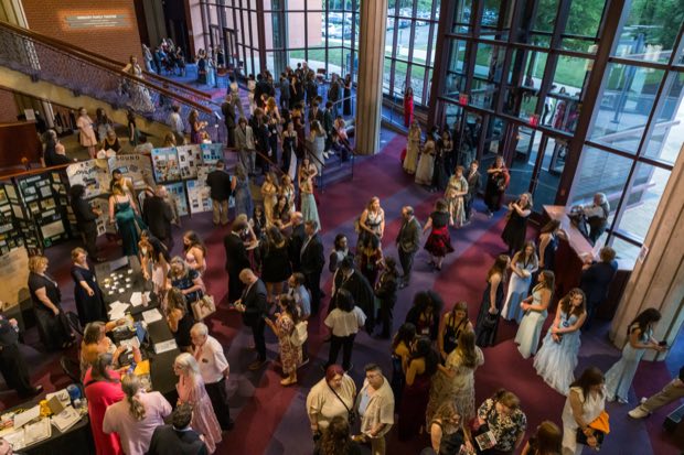 The lobby fills before curtain