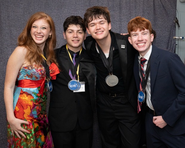 A Glamies honoree with their award