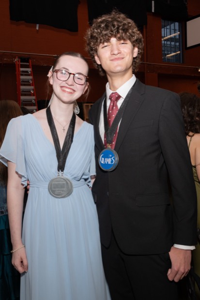 A Glamies honoree with their award