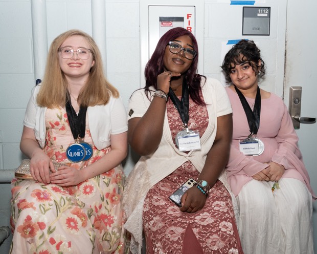 A Glamies honoree with their award