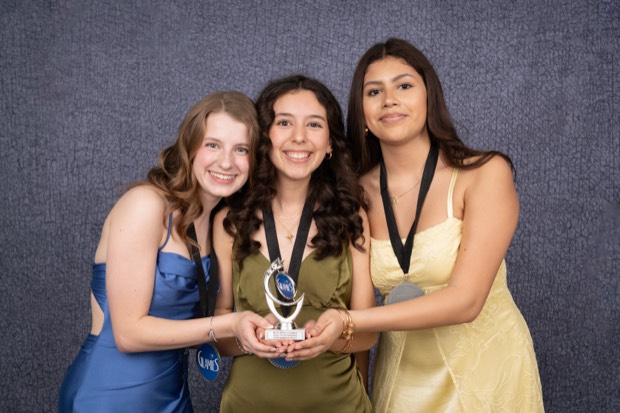 A Glamies honoree with their award